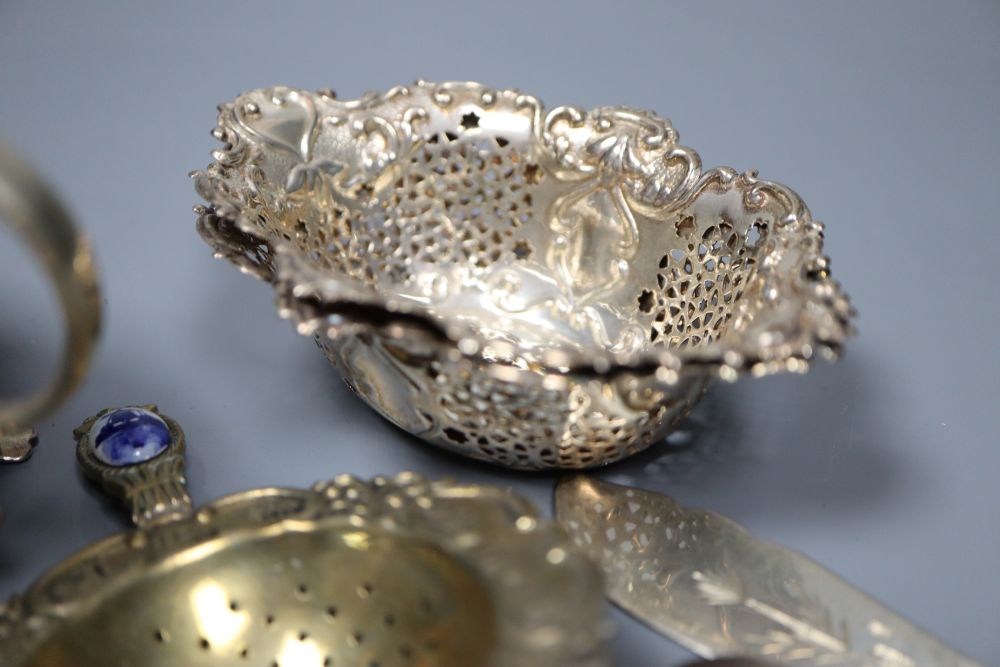 A silver sugar bowl and cream jug, a pair of nut dishes and sundry small silver